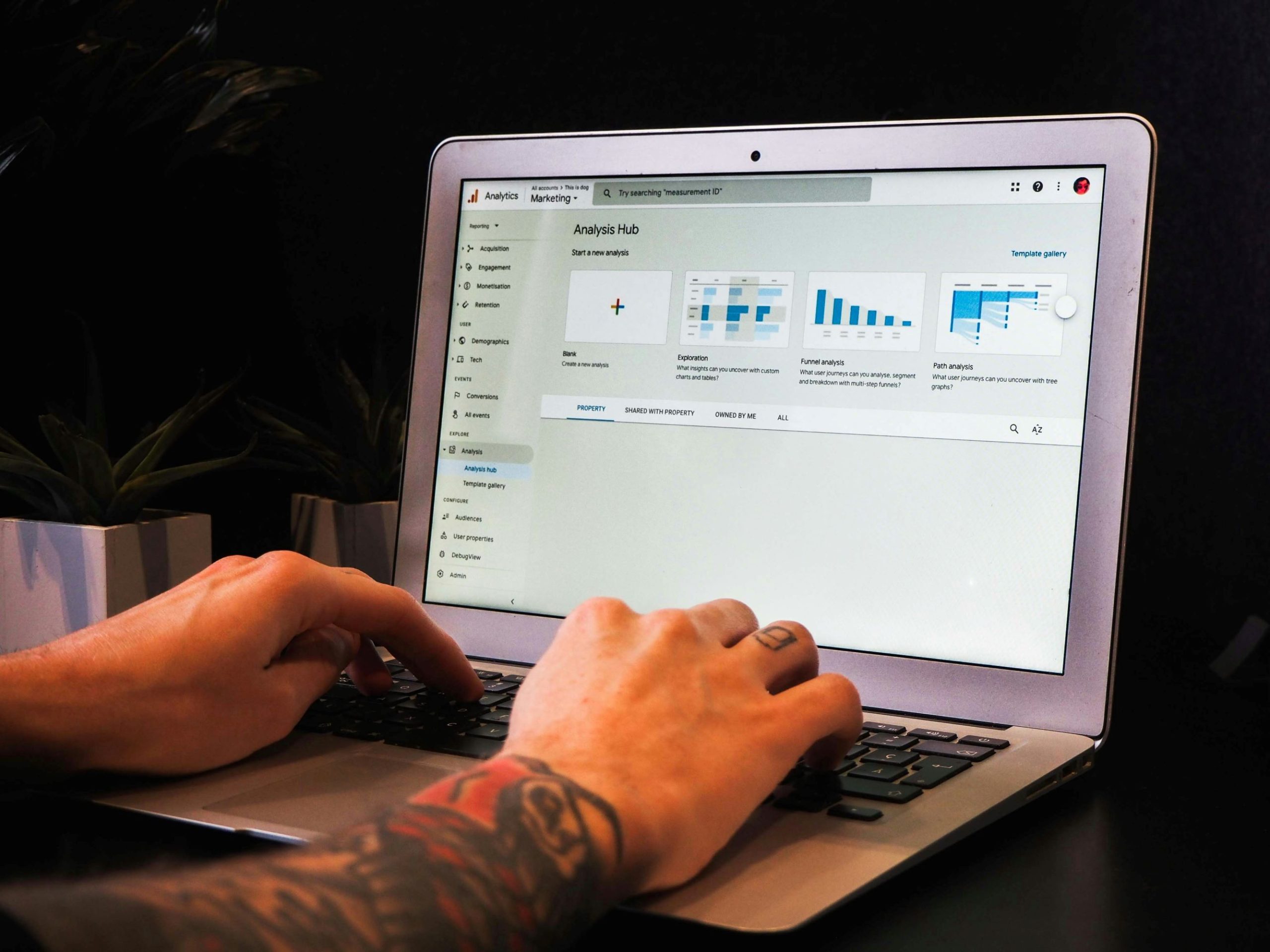 Person analyzing social media performance on Google Analytics
